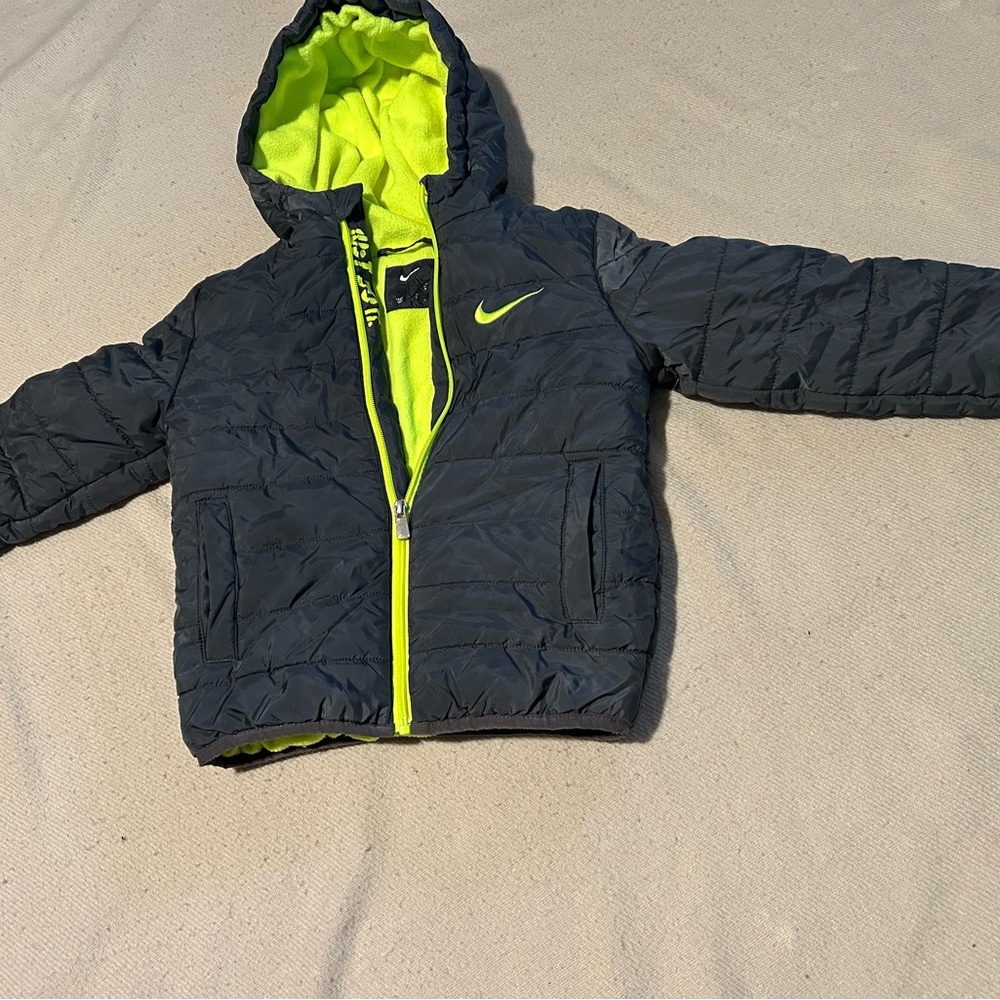 Nike Jacket in Black and Bright Yellow size 5 SP the letters are distorted